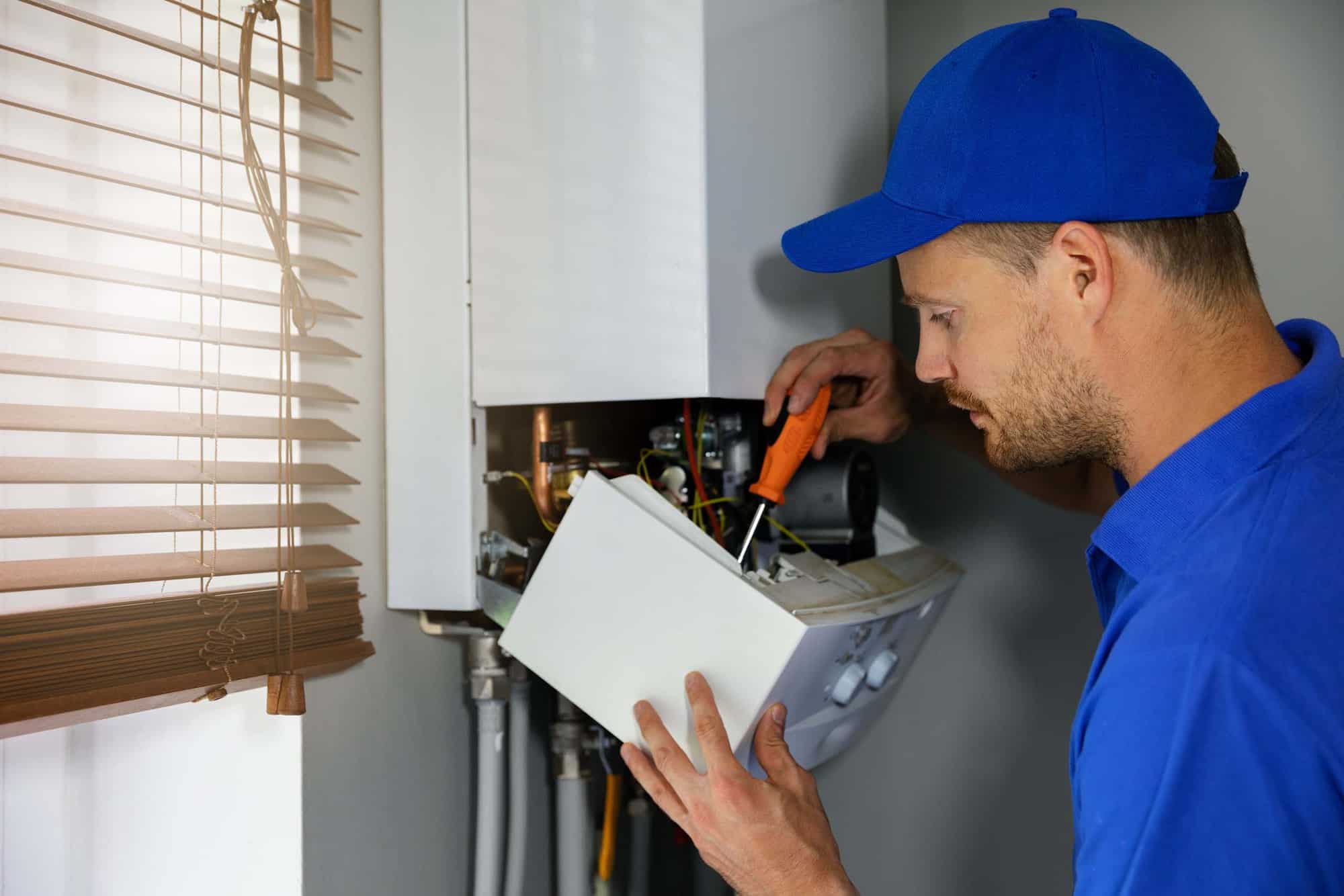 Image of a PJ Bryer heating engineer carrying out a boiler service